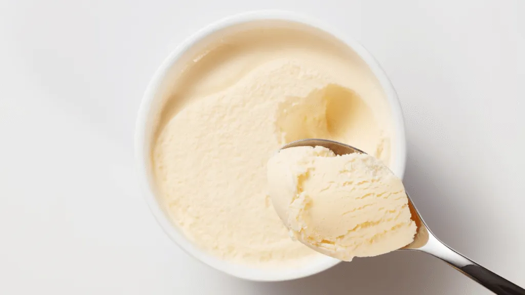 A delectable pint of Breyers ice cream, the centerpiece of your frozen dessert dreams. A sleek, modern container with the iconic Breyers logo stands prominently in the foreground, catching the light from a soft, warm illumination. The ice cream itself glistens with a creamy, inviting texture, its flavors hinted at by subtle shadows and highlights. In the middle ground, a clean, minimalist background allows the pint to take center stage, while the depth of field blurs the edges, creating a sense of focus and attention on the star of the scene. The overall mood is one of indulgence, sophistication, and the pure pleasure of enjoying a high-quality, artisanal ice cream experience. A World of Flavors in Every Pint of Breyers Ice Cream