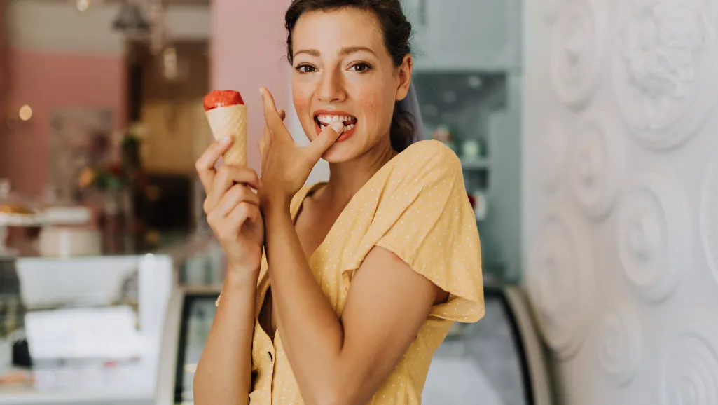 A group of people gathered around a table, intently tasting various ice cream flavors. The scene is illuminated by warm, natural lighting, creating a cozy and inviting atmosphere. In the foreground, we see delicate glass dishes filled with scoops of creamy, colorful ice cream. The tasters, dressed casually, lean in, spoons poised, as they evaluate each flavor with concentration and delight. The middle ground features a variety of ice cream containers, showcasing the diverse selection. In the background, a softly blurred kitchen setting provides a relatable context. The overall composition conveys a sense of discovery, camaraderie, and the joy of savoring the best ice cream brands.