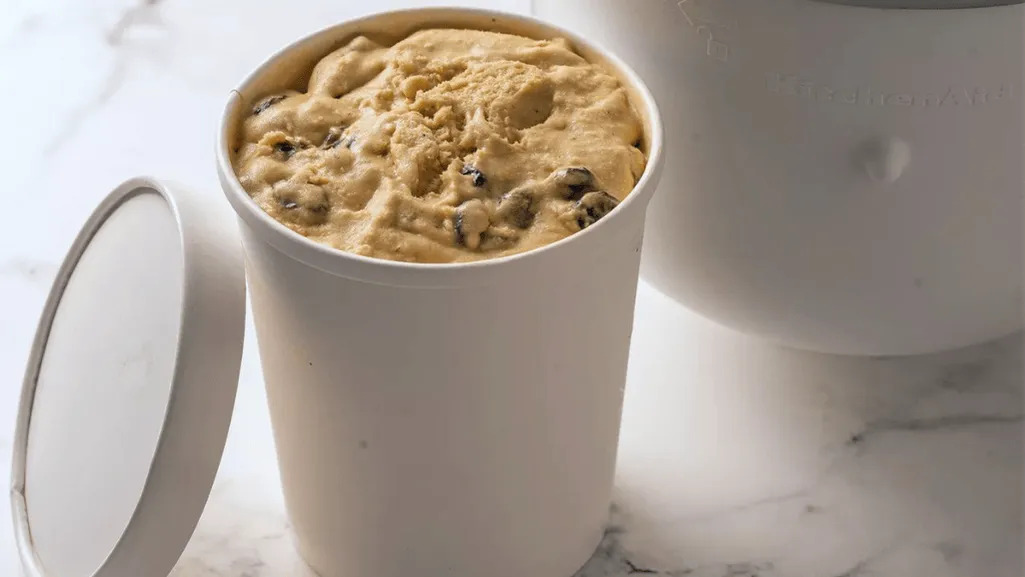 A well-lit kitchen counter with an assortment of airtight plastic, glass, and stainless steel food storage containers in various sizes and shapes. The containers are arranged in a visually appealing manner, showcasing their utility and organization. Soft shadows and highlights create a sense of depth, emphasizing the diverse textures and materials. The overall scene has a clean, minimalist aesthetic, reflecting the importance of proper food storage for preserving the quality and freshness of homemade ice cream. Safely Storing Homemade Ice Cream