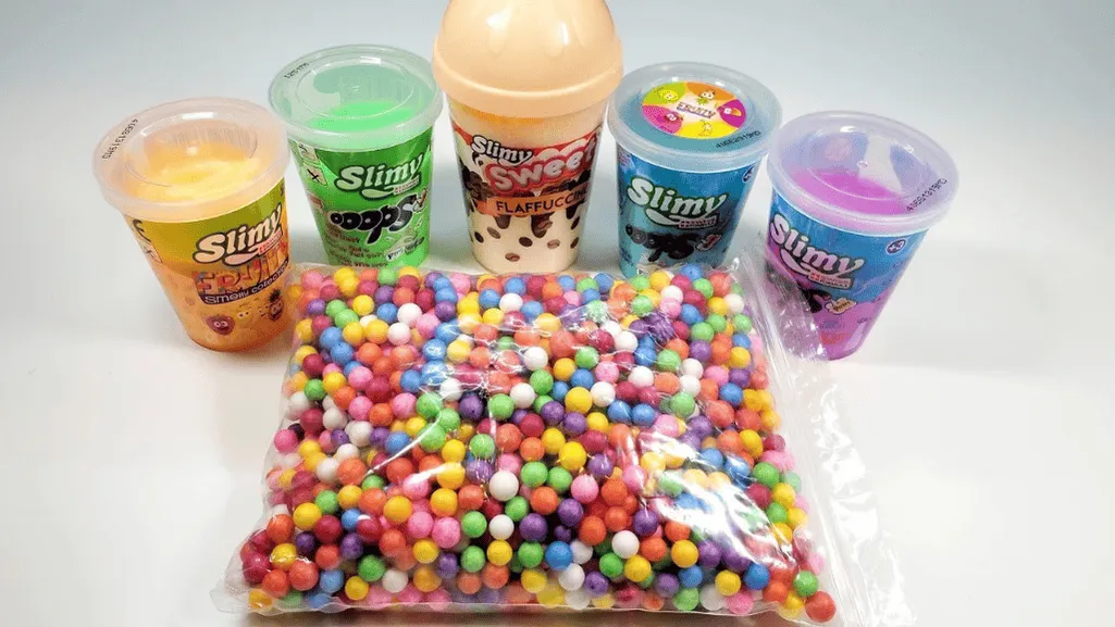 A brightly lit kitchen counter, with a bottle of dish soap, a clean sponge, and a pair of rubber gloves arranged in the foreground. In the middle ground, an open carton of ice cream sits, with a small spoon resting beside it. The background shows shelves of various food items, suggesting a well-stocked pantry. The overall scene conveys a sense of care and attention to food safety, with the safety precautions for consumption of the potentially spoiled ice cream clearly visible. What to Do If Ice Cream Becomes Slimy