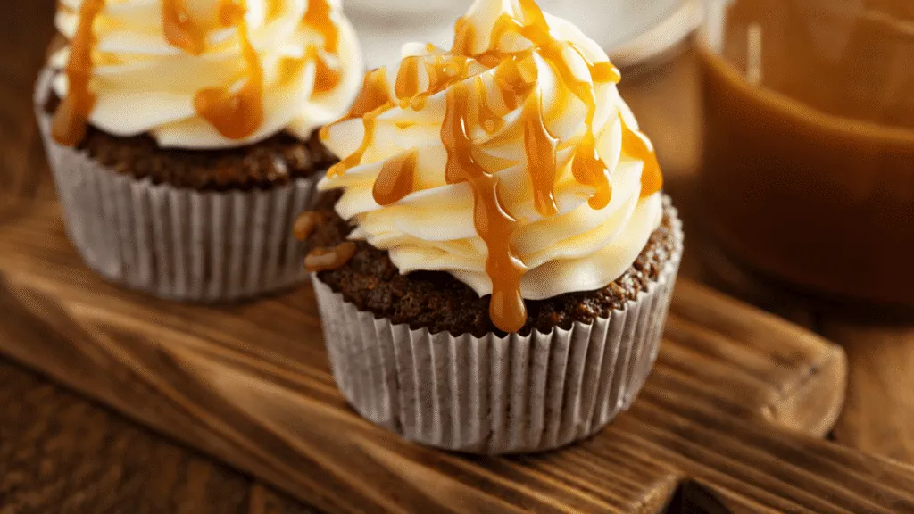 A neatly arranged still life of the essential ingredients for a perfect butterscotch ice cream recipe, captured in warm, golden lighting. In the foreground, a glass jar filled with rich, amber-hued butterscotch sauce, surrounded by a handful of whole, unshelled walnuts and a sprinkling of brown sugar. In the middle ground, a small copper saucepan and a wooden spoon, hinting at the process of creating the sauce. In the background, a textured, linen-like surface provides a neutral backdrop, allowing the ingredients to take center stage. The overall composition evokes a sense of homemade indulgence and culinary craftsmanship. Essential Ingredients for a Perfect Butterscotch Ice Cream Recipe