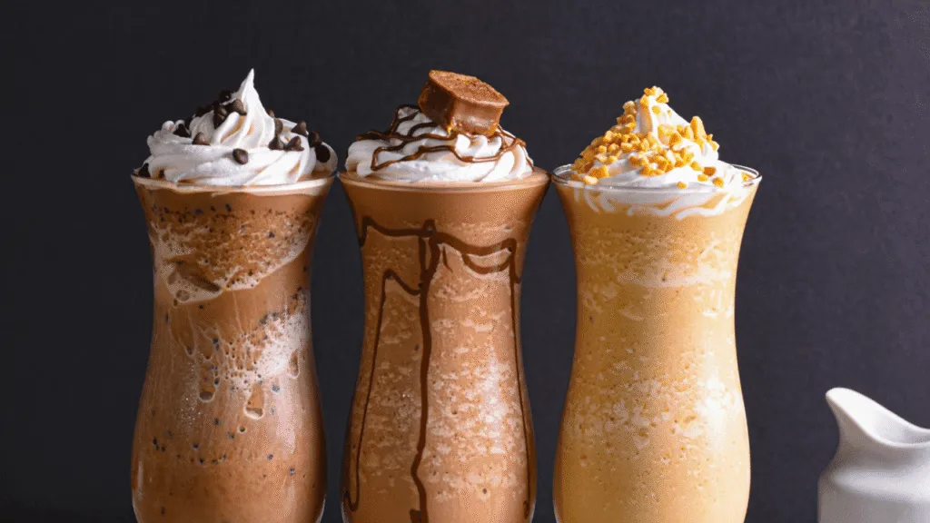 A delicate swirl of fresh, silky whipped cream crowns a luscious chocolate milkshake. The creamy topping glistens under warm, diffused lighting, casting a soft, inviting glow. The shake rests on a sleek, white tabletop, allowing the thick, indulgent cream to take center stage. Viewed from a slight overhead angle, the scene exudes an air of sophisticated elegance, perfectly complementing the rich, decadent flavors of the chocolate shake. The elegant presentation inspires a sense of temptation, inviting the viewer to indulge in this irresistible sweet treat. Chocolate Shake Recipe Presentation and Serving Ideas